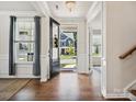 Elegant foyer with hardwood floors, an open doorway, and a view of the exterior at 924 Stebbins Dr, Fort Mill, SC 29715