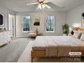 Serene main bedroom with soothing colors, natural light, and calming window views at 10301 Shelter Rock Ct, Charlotte, NC 28214