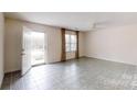 Bright living room with tile floors, neutral walls, and ample natural light at 110 Balsam Dr, Lincolnton, NC 28092
