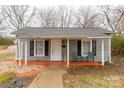 Charming exterior of a small house with a cozy porch and welcoming front entrance at 1141 6Th St, Lancaster, SC 29720
