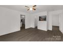 Open living room with modern flooring, neutral walls, and views into the kitchen and bathroom at 1141 6Th St, Lancaster, SC 29720