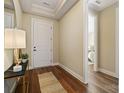 Inviting foyer with hardwood floors and neutral paint at 13101 Cozy Ct, Charlotte, NC 28215