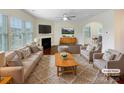 Bright living room with fireplace, modern furnishings, and an open layout at 133 Sequoia St, Mooresville, NC 28117