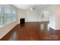 Spacious living room with hardwood floors, natural light, and a fireplace at 133 Sequoia St, Mooresville, NC 28117