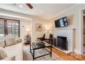 Cozy living room featuring a fireplace, hardwood floors, and comfortable seating for relaxing and entertaining at 1409 Cortland W Rd, Charlotte, NC 28209