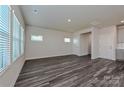 Spacious living area with gray floors, bright windows, and open access to the kitchen at 1421 31St Ne St, Conover, NC 28613