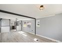 Bright living room with ample natural light and modern floors flowing into the kitchen at 144 Cherokee Ln, New London, NC 28127