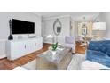Beautifully designed living room with hardwood floors, comfortable seating, and contemporary decor throughout at 1817 Jameston Dr, Charlotte, NC 28209