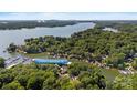 Aerial shot of a charming neighborhood with lake access and lush greenery showcasing waterfront living at 27056 Catamaran Dr, Tega Cay, SC 29708