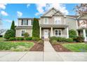 Charming two-story home featuring landscaped yard and a welcoming front porch during daytime at 3350 Keady Mill Loop, Kannapolis, NC 28081