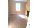 Bright bedroom featuring light wood-look flooring and neutral walls at 336 Hudson St, Shelby, NC 28150