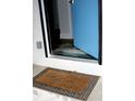 Welcoming entryway featuring a welcome mat and a blue door at 407 E Talleyrand St, Monroe, NC 28112