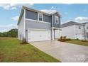 Lovely two-story home with a two-car garage and freshly mulched landscape beds at 410 Luna Ln, Shelby, NC 28152