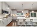 Modern kitchen with a center island, stainless steel appliances, and ample counter space, creating a functional and stylish design at 4660 Ardmore Ln, Harrisburg, NC 28075