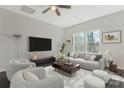 Spacious living room with modern furnishings, bright windows, and ceiling fan at 511 Roberts St, Shelby, NC 28150