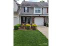 Cozy townhome with front lawn, colorful plantings, and private entrance at 5963 Moose Ln, Charlotte, NC 28269