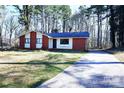 Charming single story home boasts a front yard and long drive at 6245 Snowcrest Ct, Charlotte, NC 28212