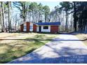 Charming single story home boasts a front yard and long drive at 6245 Snowcrest Ct, Charlotte, NC 28212