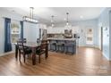 Modern, eat-in kitchen featuring stainless steel appliances, granite countertops, and a center island with bar seating at 629 Gants Rd, York, SC 29745