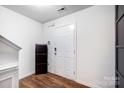 Bright foyer with hardwood floors and white walls, offering a clean and modern entrance at 638 Nannyberry Ln, Concord, NC 28025