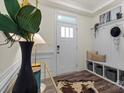 Hallway with a bench and coat rack offers seating and storage when you first enter the home at 6450 Keeton Ln, Harrisburg, NC 28075