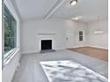 Bright living room featuring a fireplace, large window, and open concept design at 775 Bridgewood Dr, Rock Hill, SC 29732