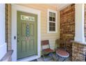 Inviting front door area with a seating area for guests at 8009 Whitehawk Hill Rd, Waxhaw, NC 28173