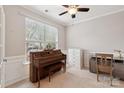 Bright office space featuring a classic piano, neutral carpet, and ample natural light at 8009 Whitehawk Hill Rd, Waxhaw, NC 28173
