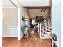 Open concept living area with hardwood floors, a stone fireplace, and staircase at 816 Springs Rd, Dallas, NC 28034