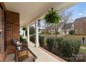 Inviting front porch with comfortable seating and decorative plants, perfect for relaxing outdoors at 8806 Cool Meadow Dr, Huntersville, NC 28078