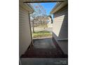 View from breezeway overlooking the front yard and street beyond at 104 Johnsbury Dr, Stanley, NC 28164