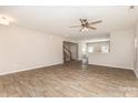 Spacious living room featuring wood-look floors and open floor plan with access to the kitchen at 1120 Freeman View Dr, Albemarle, NC 28001