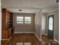 Spacious living room features hardwood floors, natural light, and a built-in bookcase at 1873 Rocky River Rd, Lancaster, SC 29720