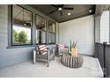 Relaxing porch with seating area, modern furniture, and neutral color palette at 209 Halemarg Dr, Belmont, NC 28012