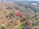 Aerial view of property's location on a tree-lined street in a quiet neighborhood at 406 Forest Dr, York, SC 29745