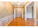 Elegant foyer boasting gleaming hardwood floors, decorative moldings, and stylish chandelier at 406 Forest Dr, York, SC 29745