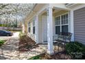Charming front porch featuring a decorative bench, lush landscaping, and the unit's address at 639 Fawnborough Ct, Rock Hill, SC 29732