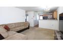 Comfortable living room featuring a plush sectional sofa and open layout to the kitchen at 639 Fawnborough Ct, Rock Hill, SC 29732
