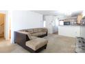 Spacious living room with cozy sectional couch, leading to a kitchen and staircase at 639 Fawnborough Ct, Rock Hill, SC 29732