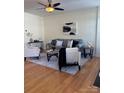 Inviting living room featuring contemporary furnishings, hardwood floors, and neutral colors at 6410 Hasley Woods Dr, Huntersville, NC 28078