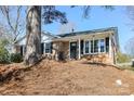 Brick house with black shutters, well maintained landscaping at 7124 Brynhurst Dr, Charlotte, NC 28210
