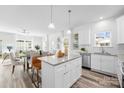 Bright open kitchen with granite countertops, stainless steel appliances, and island seating, great for entertaining guests at 743 Separk Cir, Gastonia, NC 28054