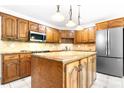 Traditional kitchen featuring a large island, stainless steel appliances, and ample cabinet space, perfect for cooking at 1080 Rolling Green Dr, Newton, NC 28658