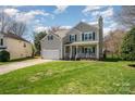 Attractive home with a well-kept lawn and inviting front porch perfect for relaxing at 13602 Red Wine Ct, Charlotte, NC 28273