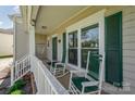 Inviting front porch with rocking chairs, perfect for relaxing and enjoying the outdoors at 13602 Red Wine Ct, Charlotte, NC 28273