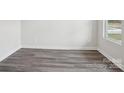 Neutral bedroom offering new vinyl floors and a bright window view at 150 Aberdeen Dr, Salisbury, NC 28144