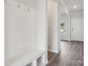 A mudroom with a built-in bench and storage for coats and shoes at 150 Aberdeen Dr, Salisbury, NC 28144