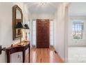 Inviting foyer featuring a hardwood floor, a decorative mirror, and a bright, airy feel at 1751 5Th Ne St, Hickory, NC 28601
