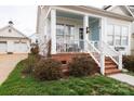 Close up featuring a charming covered porch with classic white columns and blue ceiling at 23128 Goose Down Ln, Lancaster, SC 29720