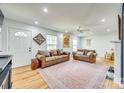 Bright living room with hardwood floors, two leather couches, and abundant natural light at 362 Ranson Rd, Lancaster, SC 29720